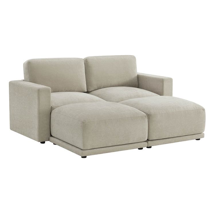 Angled view of a beige loveseat with plush cushions and armrests, showcasing its modern design.
