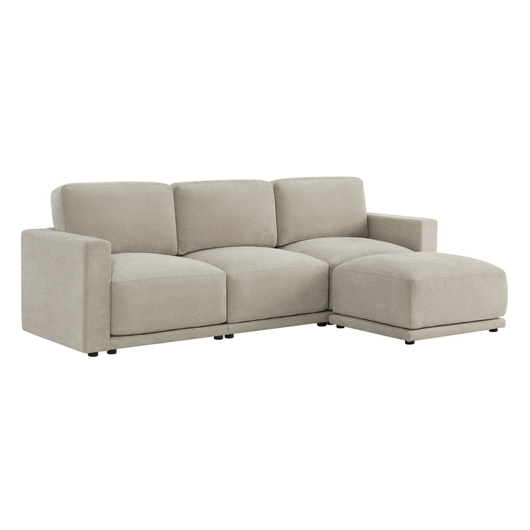 Three-seater beige couch with an extended chaise section on the right.