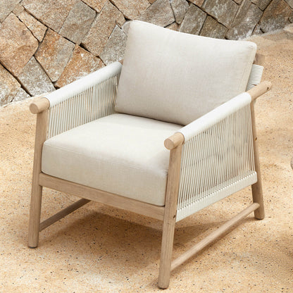 A Sienna Modern Acacia Wood Woven Outdoor Bistro Set chair with cushions