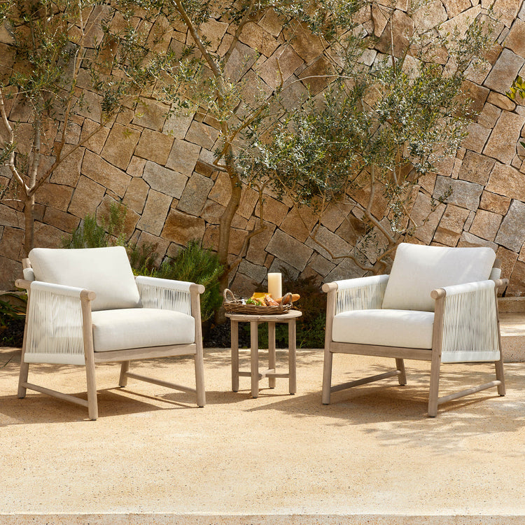 Sienna Modern Acacia Wood Woven Outdoor Bistro Set with two chairs and a small table in a sunny patio.