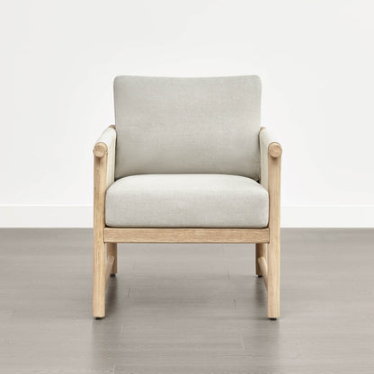 A Sienna Modern Acacia Wood Woven Outdoor Bistro Set chair with light beige cushions on a wooden floor.
