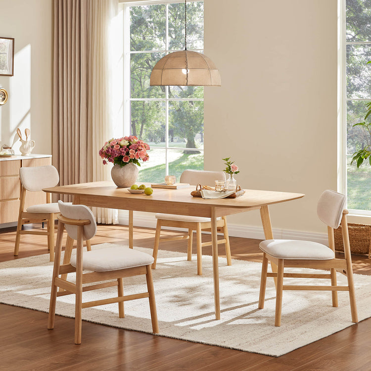 Hilda light oak extendable dining table, rounded corners, tapered legs, 4 upholstered chairs in dining room.