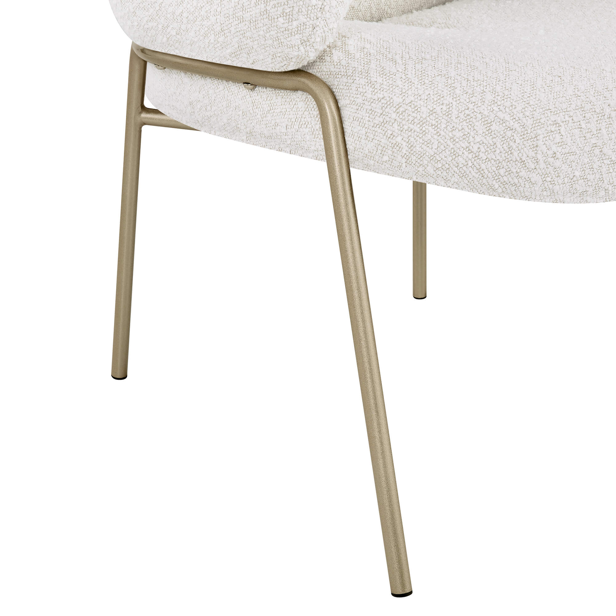 Janet cloud-shaped dining chair, close-up on cream boucle upholstery and champagne gold metal legs.
