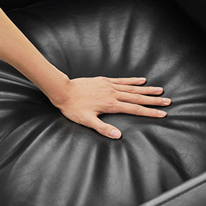 Hand pressing plush black leather cushion of Henry Modern Swivel Accent Chair - CHITA Living