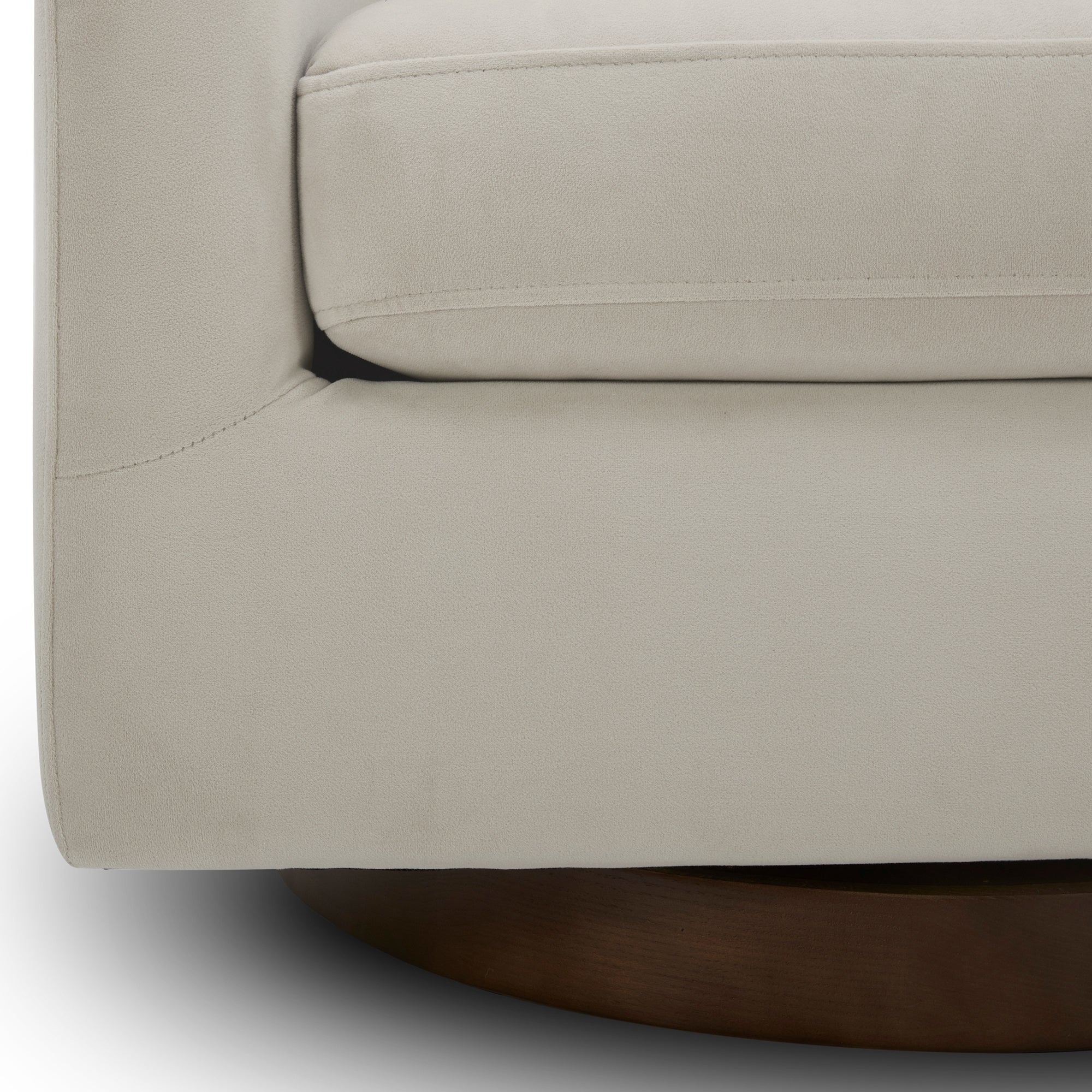 Close-up view of Wren Modern Swivel Accent Chair's plush cushion and wood base detail - CHITA Living