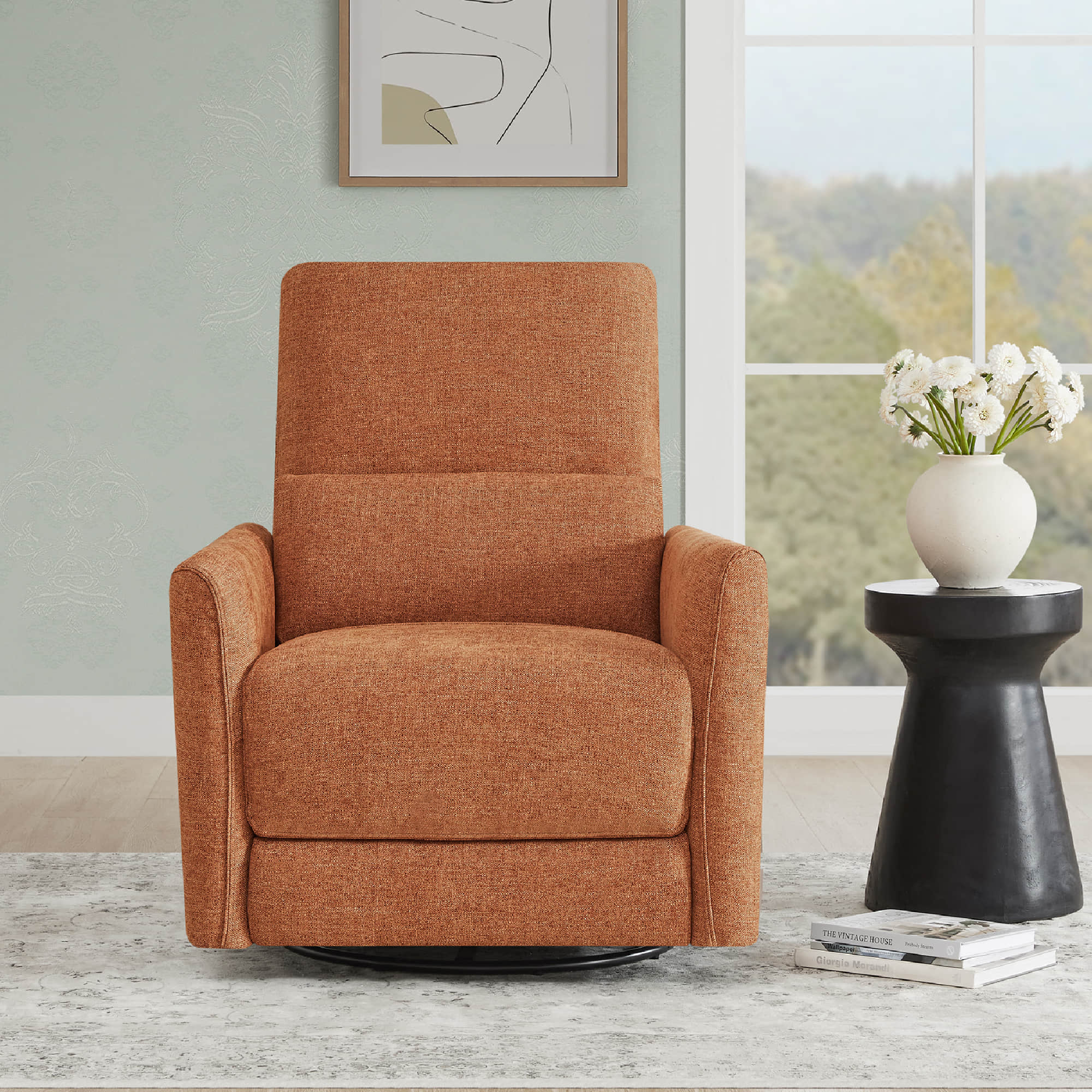 Chic orange power swivel nursery glider recliner against a window in a modern setting - CHITA Living