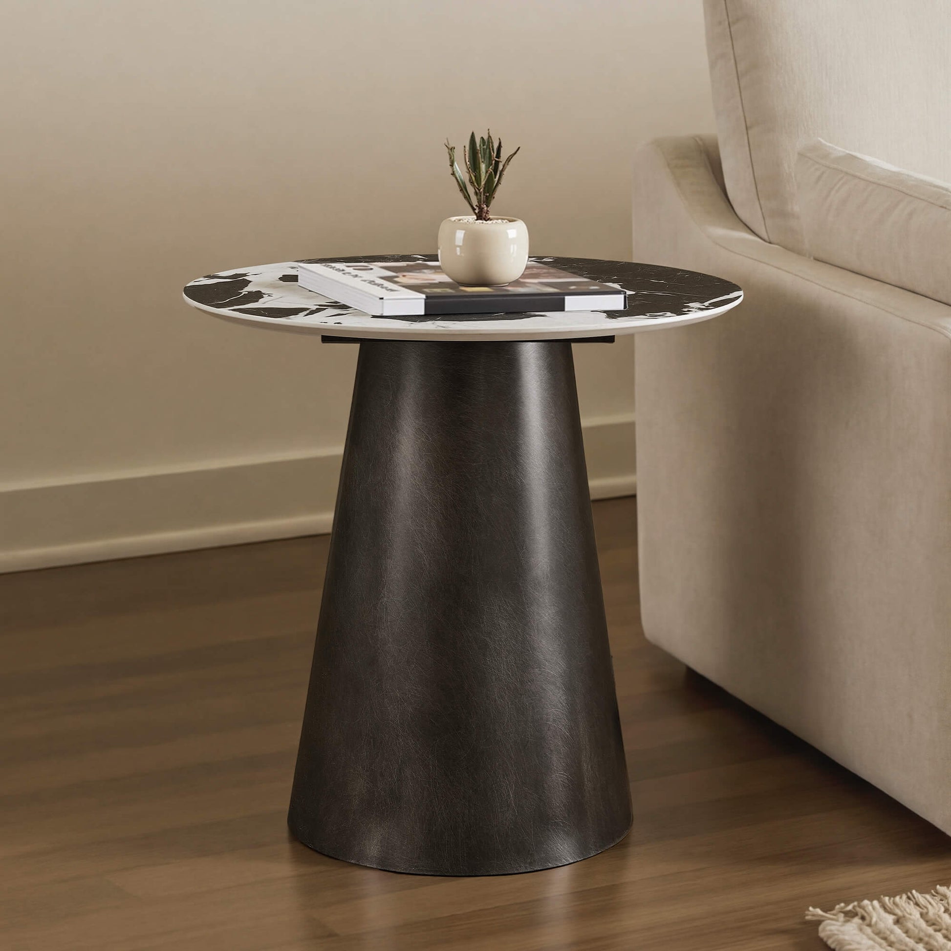 Natalie Black Ceramic Round Side Table with unique veining on top and tapered metal base.