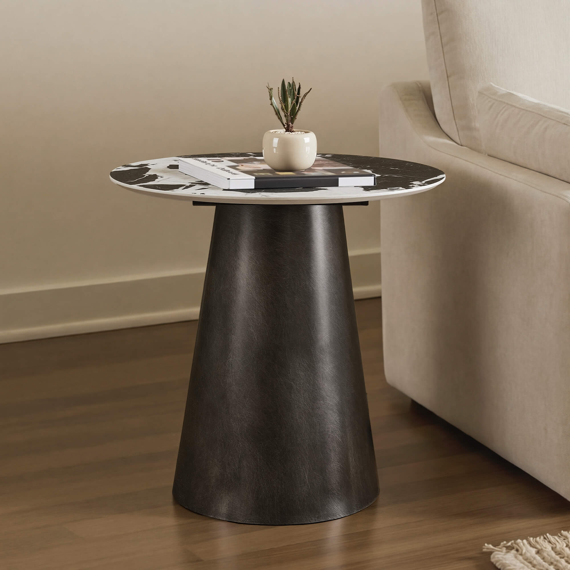 Natalie Black Sintered Stone Round Side Table with marbled top and tapered metal base.