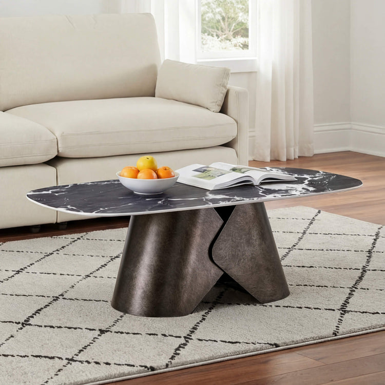 Natalie black ceramic oval coffee table with marble veining and textured dark metal base.