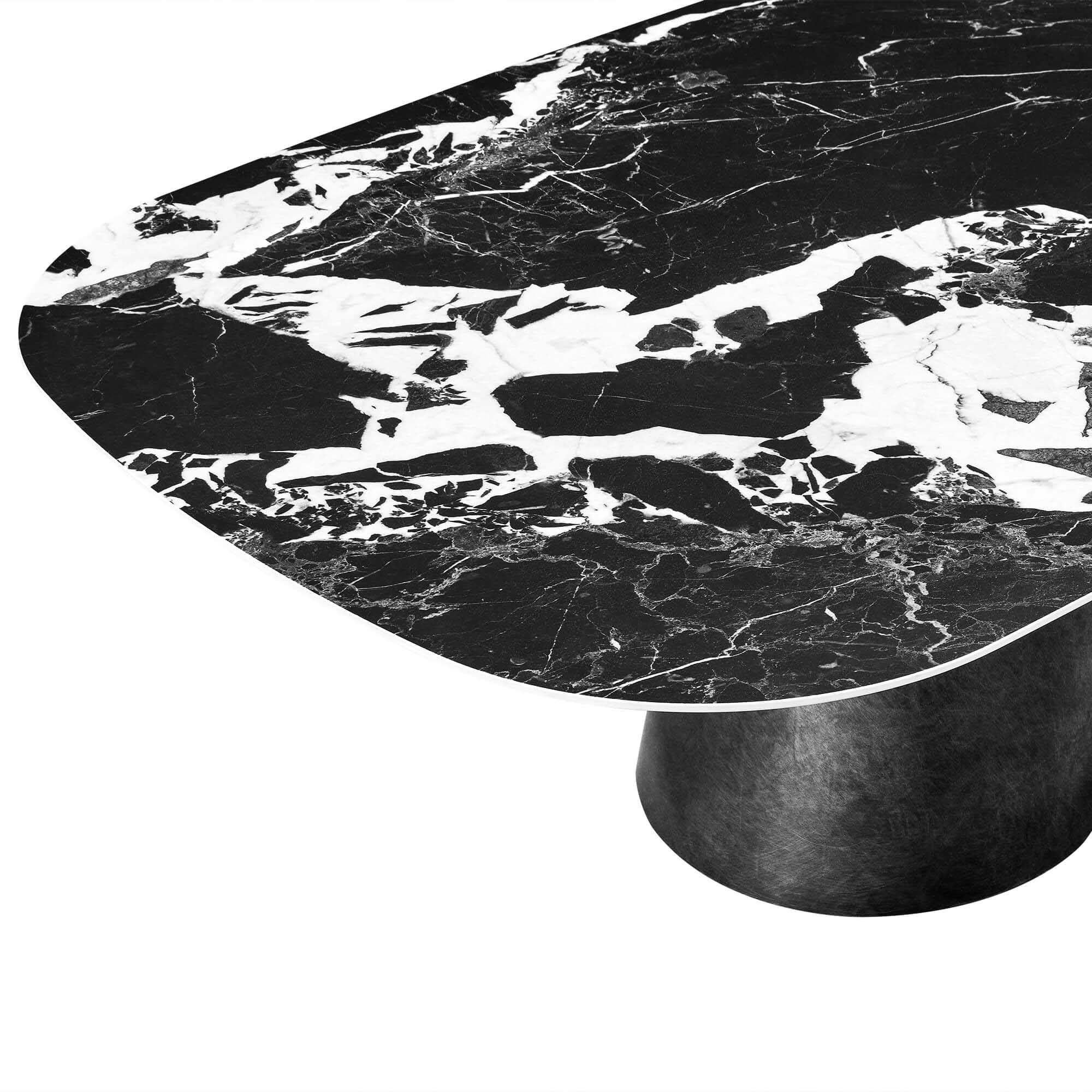 Natalie black ceramic coffee table: oval Napoleon ceramic top with dramatic white marble veining, textured black metal base.