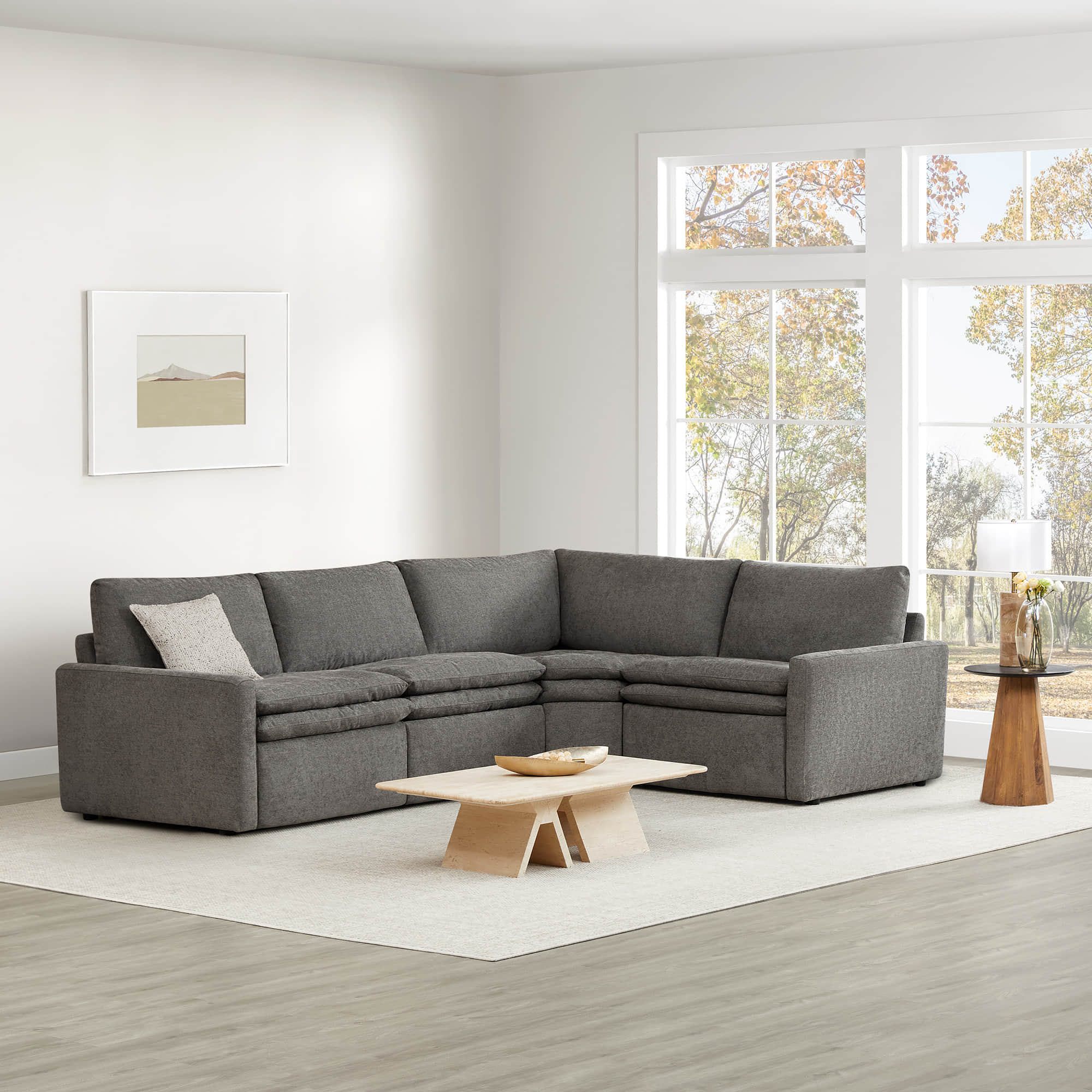 Ohana 4-Seat Motion Modular Sofa in grey, modern living room with large windows - CHITA Living