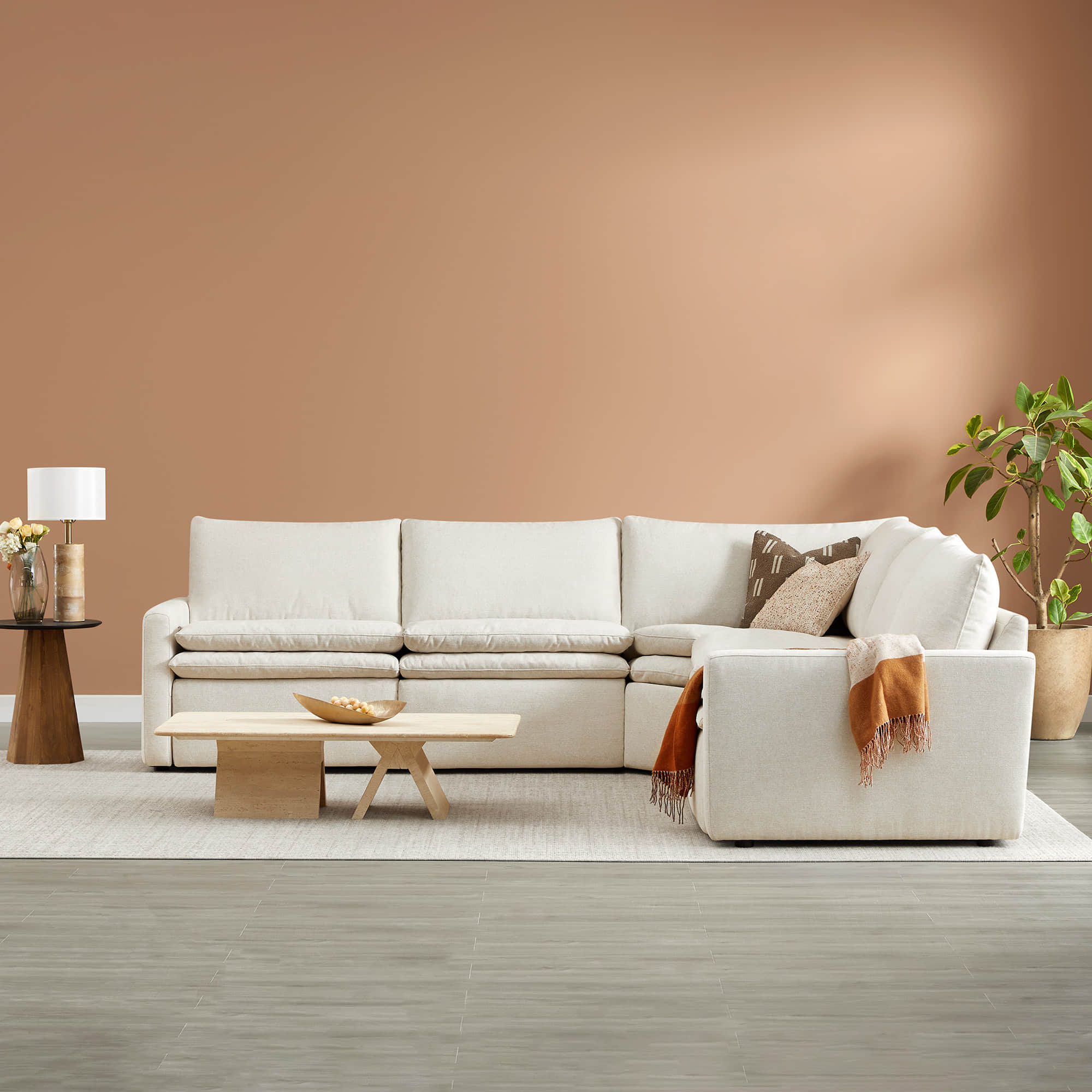 Light beige Ohana 5-seat modular sofa with matching accent chair in a cozy living room - CHITA Living