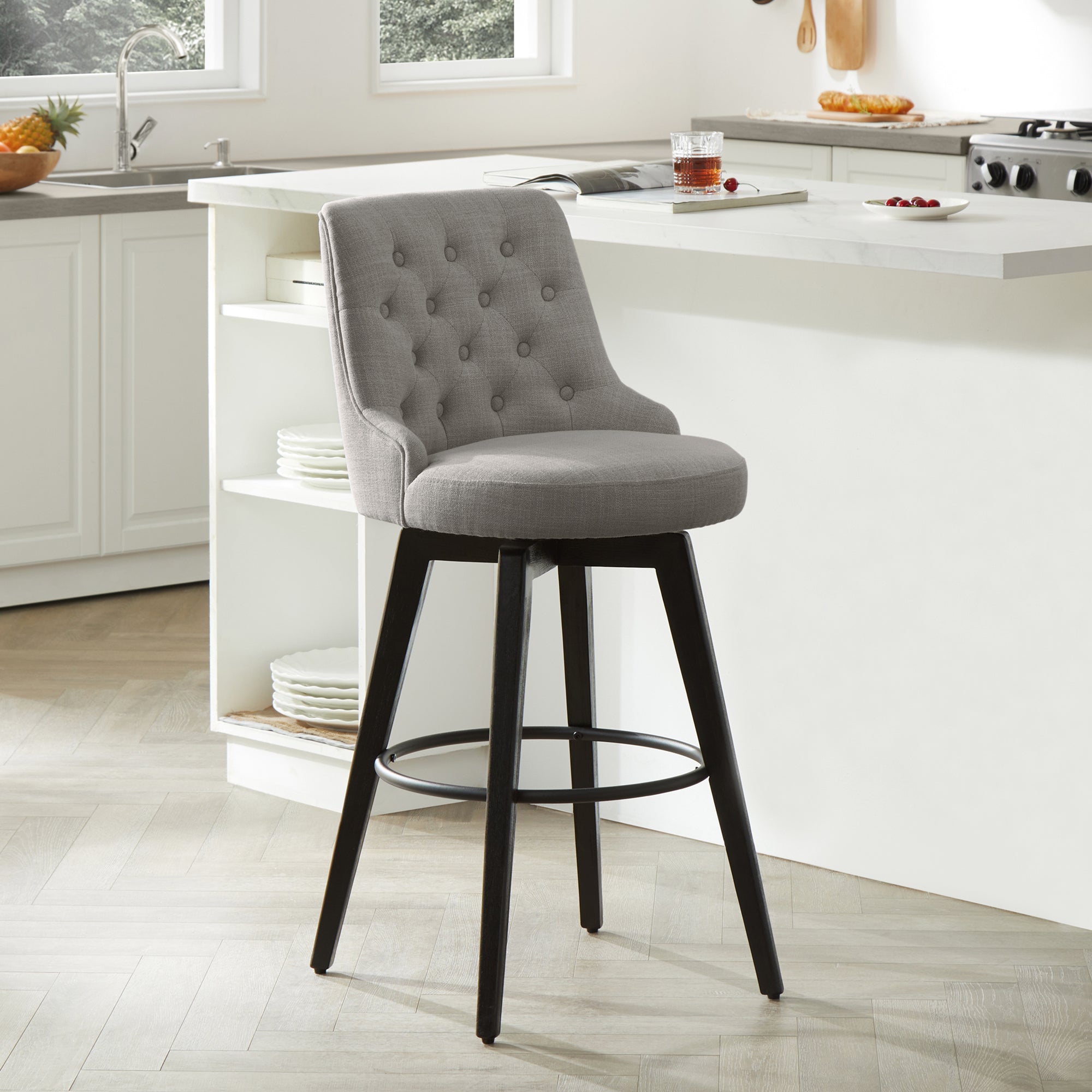 Gray tufted swivel bar stool with black legs for contemporary kitchen seating - CHITA Living