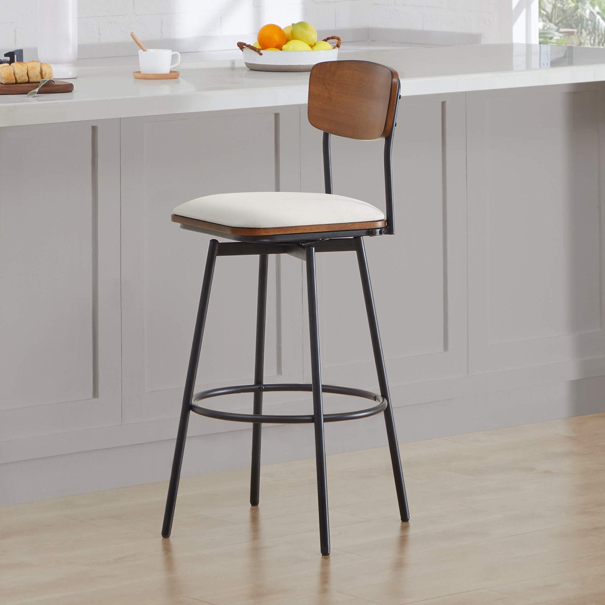 Aislinn swivel bar stool with wooden backrest and cream seat in modern kitchen setup - CHITA Living