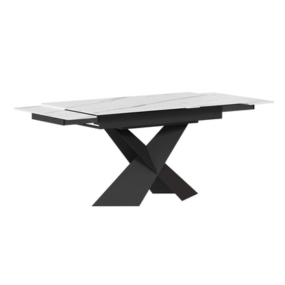 Extendable dining table with white sintered stone top and black X-shaped steel base