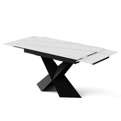 Extendable dining table with white sintered stone top and black X-shaped steel base