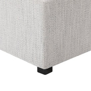 Close-up of white cube ottoman with textured surface and black feet, ideal for modern living spaces - CHITA Living