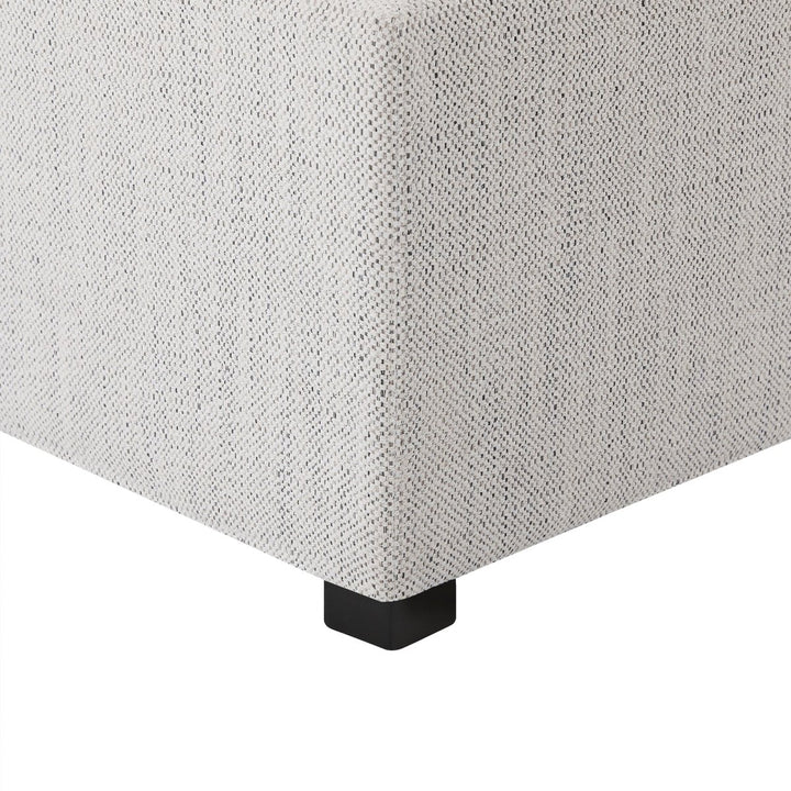 Close-up of white cube ottoman with textured surface and black feet, ideal for modern living spaces - CHITA Living