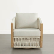Acker Woven Outdoor Bistro Set chair with cream cushions and a woven base, set against a neutral background.