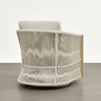 A woven outdoor swivel lounge chair with a light wood frame, viewed from the back.