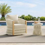 Acker Woven Outdoor Bistro Set with a chair and side table, poolside under a clear sky.
