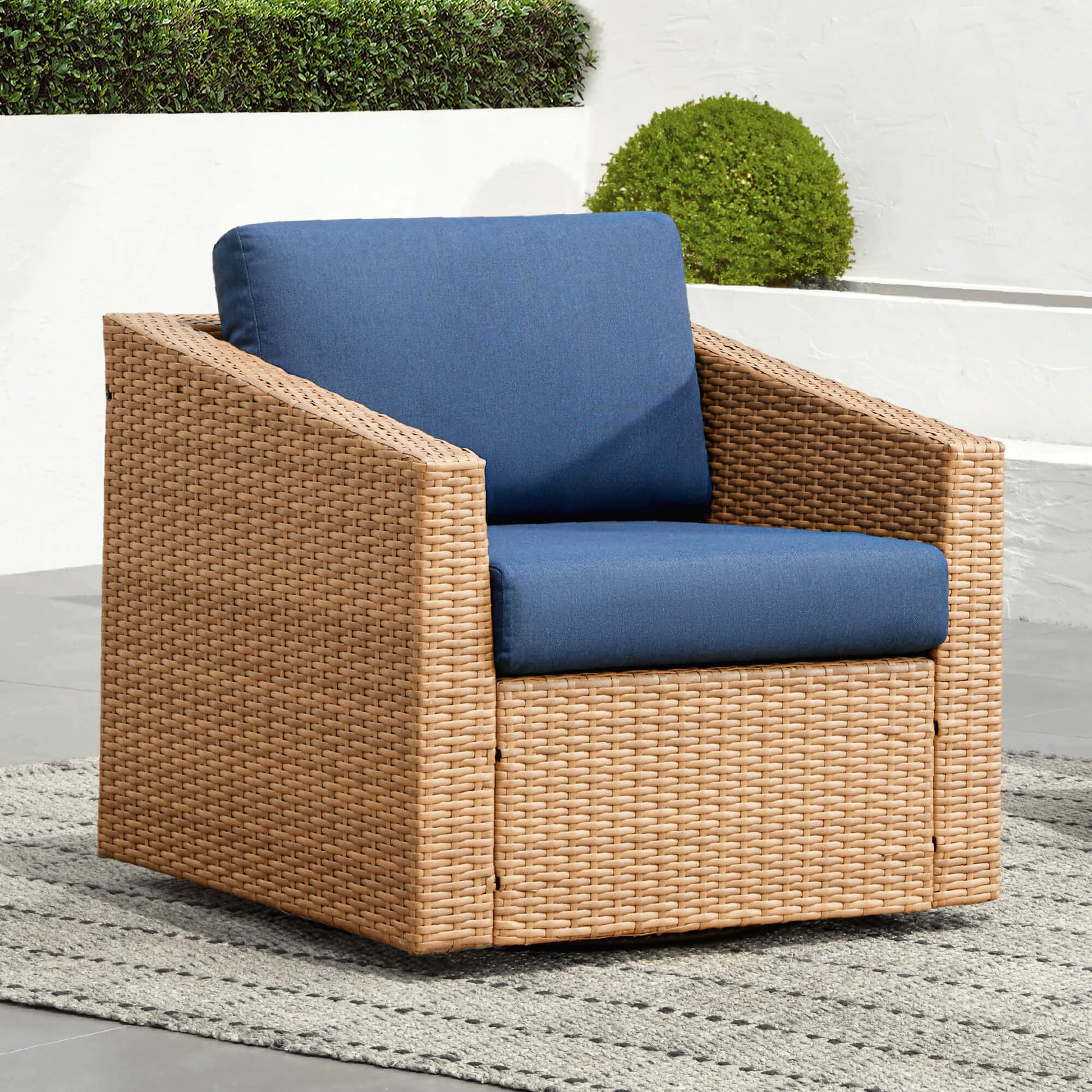 Calum Rattan outdoor chair with navy cushion, perfect for modern patio comfort - CHITA Living