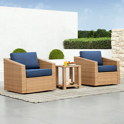 Calum Rattan Outdoor Bistro Set with navy cushions and a glass top side table for patio lounging - CHITA Living