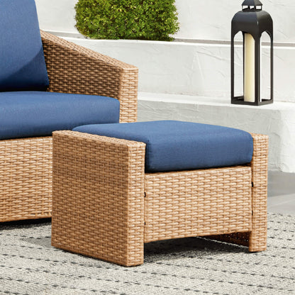 Calum Rattan outdoor ottoman with navy cushion for stylish patio relaxation - CHITA Living