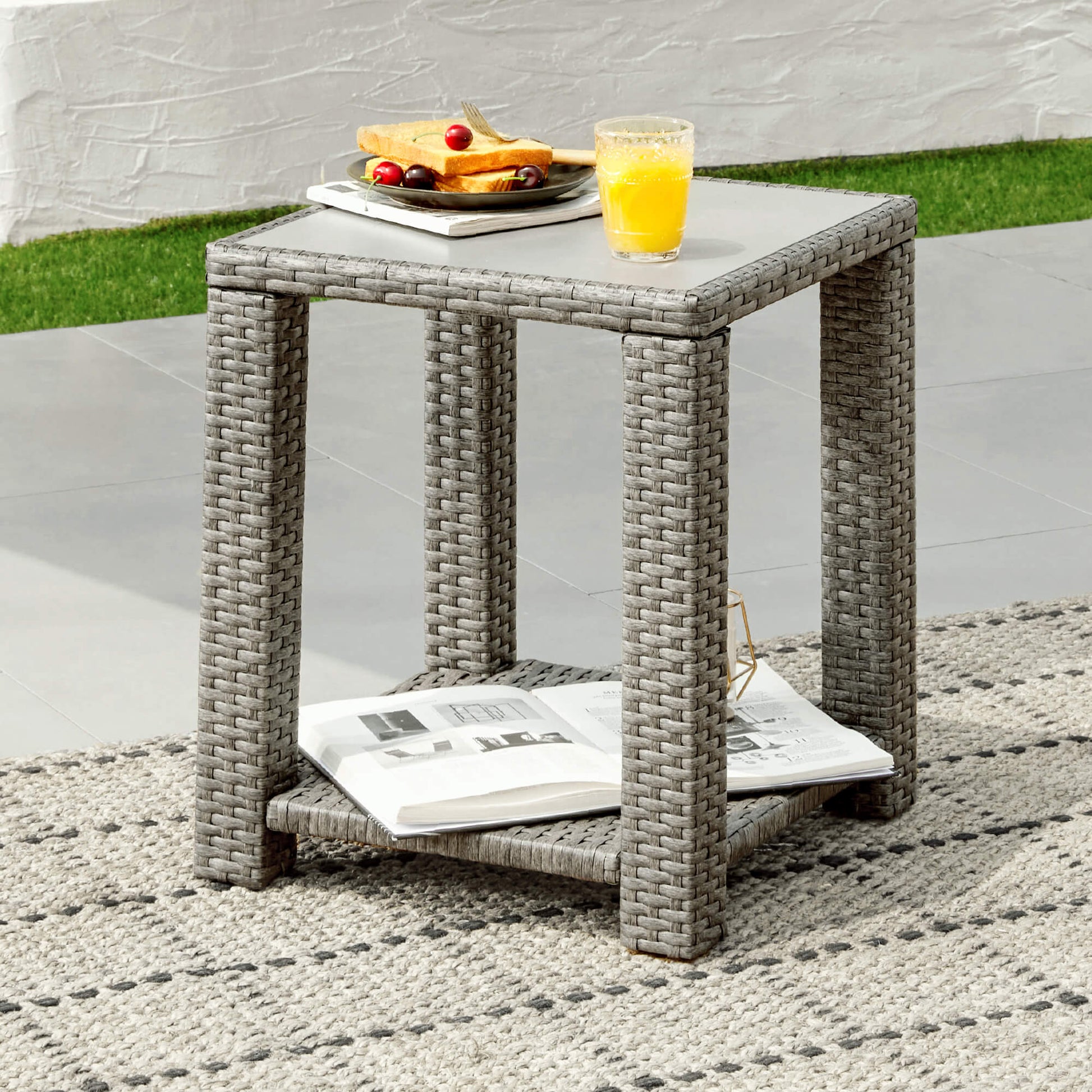 Calum Rattan Outdoor Side Table with glass top, ideal for stylish patio gatherings - CHITA Living