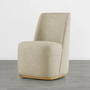 Beige textured dining chair with a curved wooden base in a minimalist room - CHITA Living