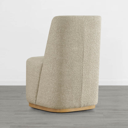 Beige wingback dining chair with curved wooden base in a modern minimalist space - CHITA Living