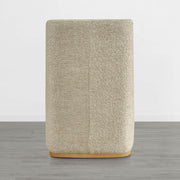 Beige textured wingback dining chair with a curved wooden base in minimalist decor - CHITA Living