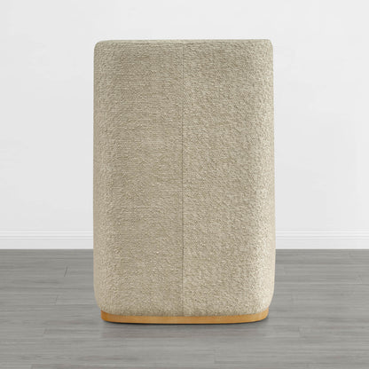 Beige textured wingback dining chair with a curved wooden base in minimalist decor - CHITA Living
