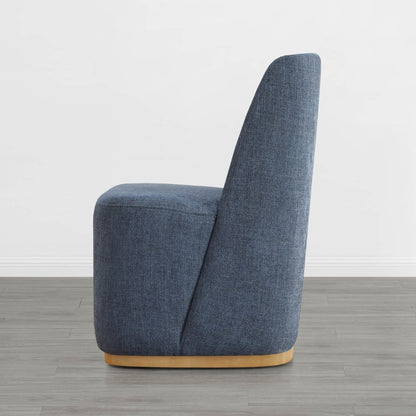 Side view of blue upholstered wingback dining chair with wooden base - CHITA Living