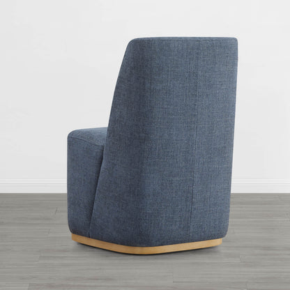 Blue upholstered wingback chair with curved wooden base in a modern setting - CHITA Living