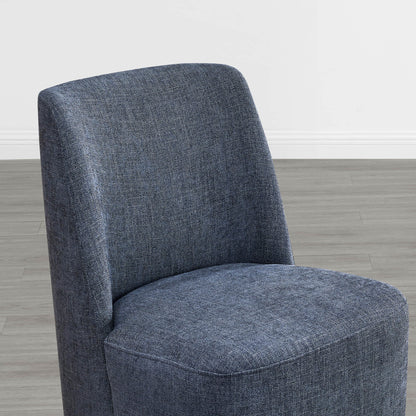 Close-up of textured blue fabric dining chair showcasing curved design - CHITA Living