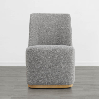 Contemporary gray upholstered dining chair with curved wooden base in minimalist setting - CHITA Living