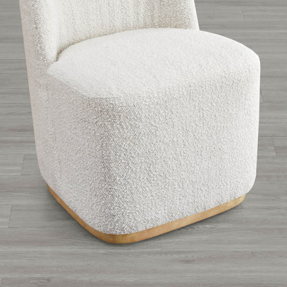Close-up of cream boucle upholstered dining chair base with curved wooden accent - CHITA Living