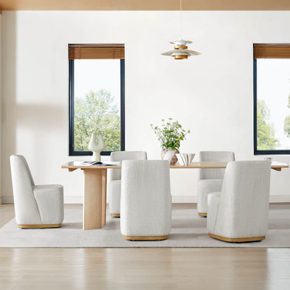 Modern dining room featuring white textured wingback chairs around a wooden table - CHITA Living