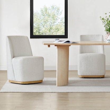 Contemporary dining space with elegant upholstered wingback chairs and a wooden table - CHITA Living