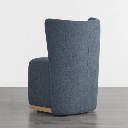 Back of blue wingback chair featuring textured fabric and a stylish curved design - CHITA Living