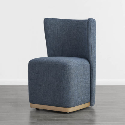 Blue wingback chair with curved wooden base in a minimalist setting - CHITA Living