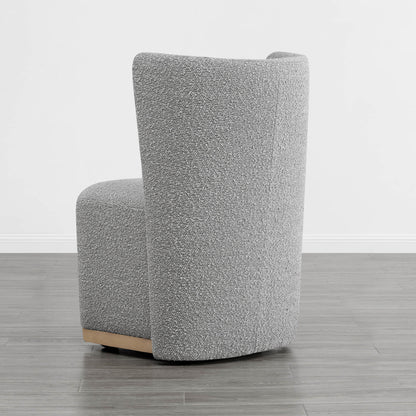 Gray upholstered wingback chair with curved design and wooden base in minimalist room - CHITA Living
