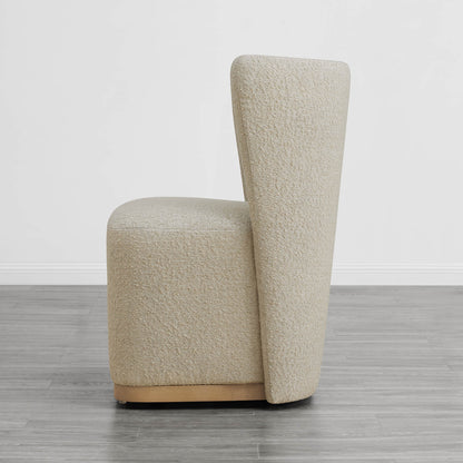 Beige textured wingback dining chair with modern curved design in minimalist interior - CHITA Living