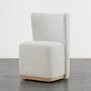 Textured cream wingback chair with modern curved design in minimalist room - CHITA Living