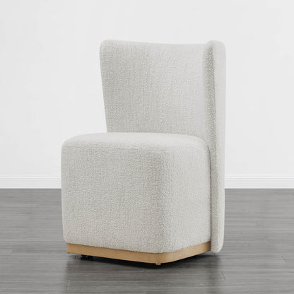 Textured cream wingback chair with modern curved design in minimalist room - CHITA Living