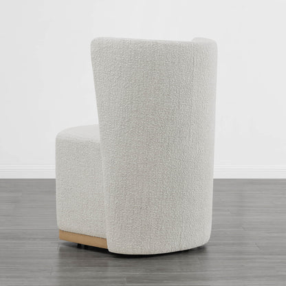 Back view of cream textured wingback chair with curved design in minimalist setting - CHITA Living