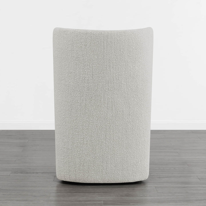 Textured beige wingback dining chair back view in minimalist room - CHITA Living