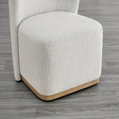 Close-up of textured cream dining chair base with curved wooden detail - CHITA Living