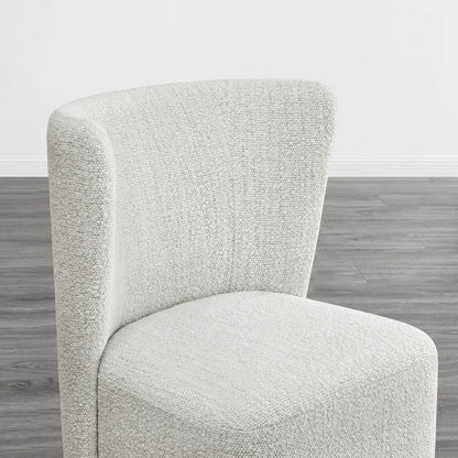 Textured cream wingback dining chair with a stylish curved design in modern interior - CHITA Living